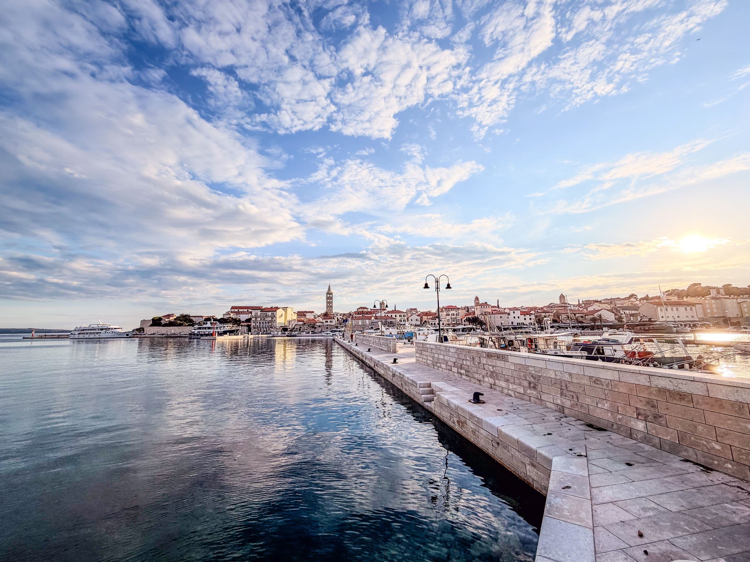 Rab old town and harbour at golden hour.